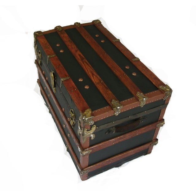 Early 1900's forest green canvas travel trunk, restored. This trunk boasts all of its original hardware with fancy metal...