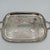 A richly detailed American silverplate serving tray by Sheffield Silver Company, its surface almost entirely given over to...