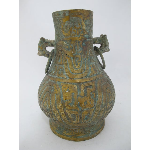Old Chinese bronze ritual wine vessel in the style of Western Zhou dynasty hu ritual wine containers. This an antique...