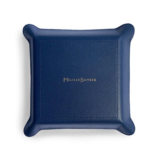 An elegant, useful accessory for entryways, desktops and bedside tables. This leather catchall neatly organizes all manner...