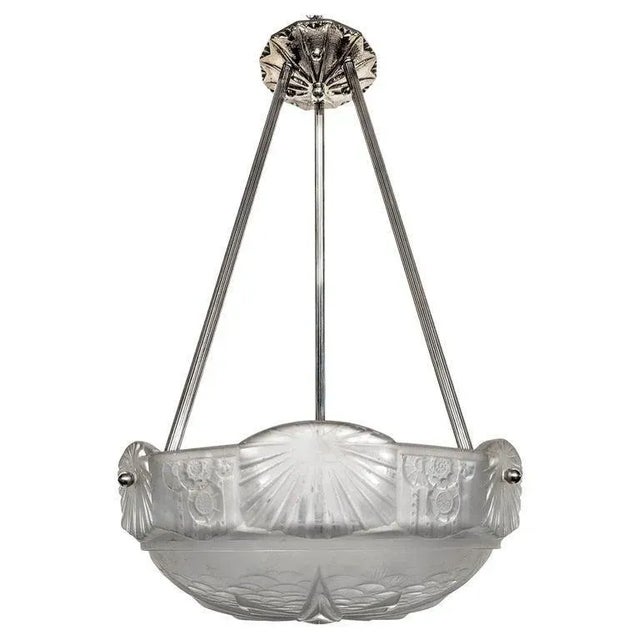 A French Art Deco pendant chandelier by the French artist “Muller Freres“ in great condition. Clear frosted molded glass...