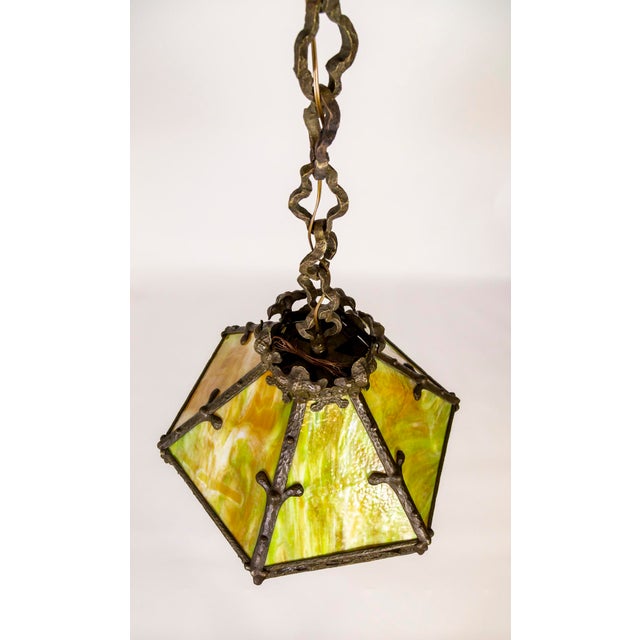 Arts & Crafts Period, Craftsman style, chandelier/pendant with Art Nouveau and Gothic influences. Rich amber and green...