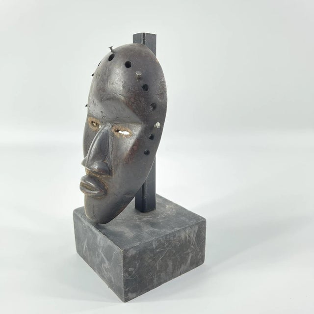 A small passport mask used to be carried around when traveling. This African mask comes from Liberia and CÃ´te d'Ivoire by...