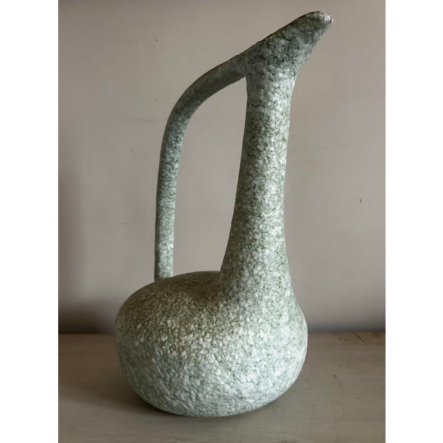 1960’s Vintage mid century modern studio pottery pitcher / vase. Features a unique textured glaze. Pale turquoise color...