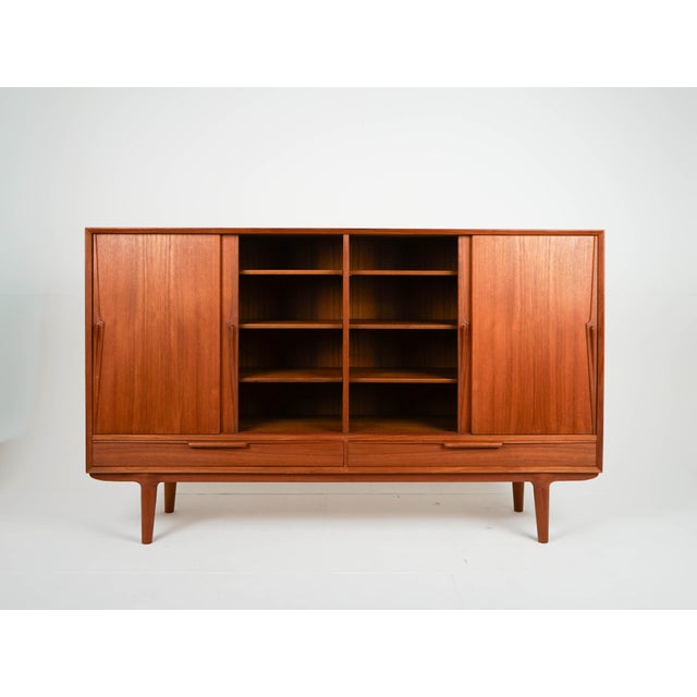 Mid-Century Danish Highboard in Teak by Gunni Omann for Omann Jun, 1960s, in Very Good conditions. Designed 1960 to 1969 I...