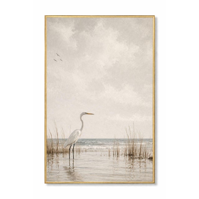 Minimalist coastal artwork featuring a solitary egret standing in shallow shoreline water, framed by soft grasses and...