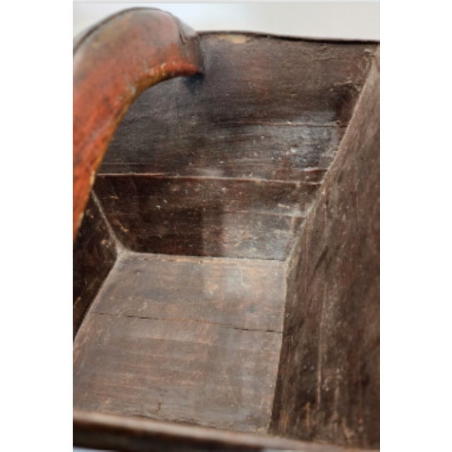 This antique basket shows the decades of use in the worn handle and the interior patina. Used for centuries to gather rice...