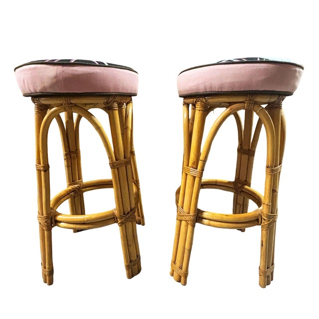 This beautifully restored 1950s single-strand "Arched" Rattan bar stool with padded blue cotton-covered seat. The stool...