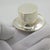 A vintage miniature depicting an elegant top hat, handcrafted in Continental Silver (800/000) in Florence between the...