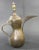 Middle Eastern traditional Arabian brass Dallah coffee pot. Coffee pot hand-hammered and chased copper with riveted brass...