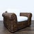 This Ralph Lauren lounge chair features a sturdy woven rattan frame with a rich brown finish. The chair includes soft...