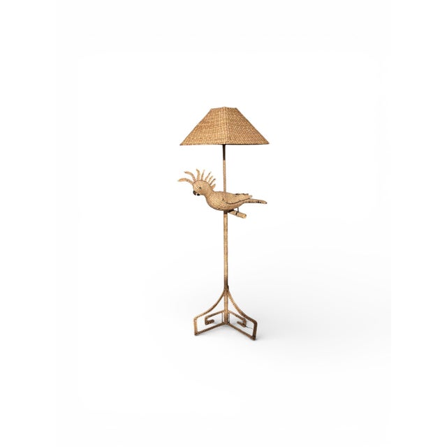 Exceptional and sculptural rattan floor lamp by Mario Lopez Torres, featuring his iconic hand-woven cockatoo motif. This...
