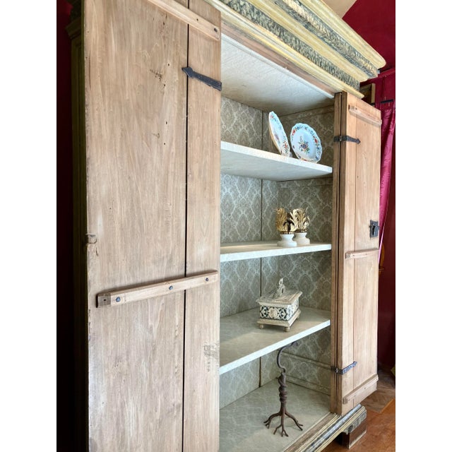 An extraordinary italian renaissance wooden cabinet from the 1500s awaits the discerning collector. This antique lacquered...