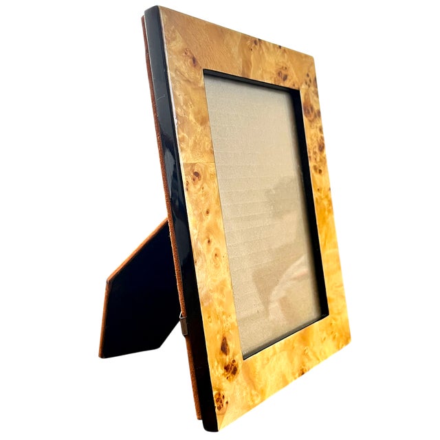 A richly figured burlwood picture frame by Two’s Company, showcasing the natural drama and variation that makes burl so...