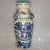 This matching pair of blue and white porcelain vases features sculpted decorative side handles. Each vase is hand-painted...