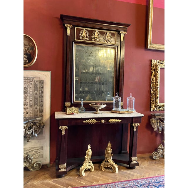 This exquisite Italian Empire period console table with mirror, dating from the late 18th to early 19th century...