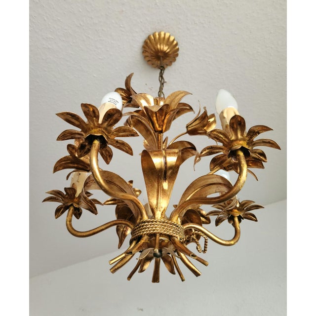 A highly decorative, beautiful, handmade, hand-forged, gold-plated florentine vintage chandelier/ceiling lamp with five...