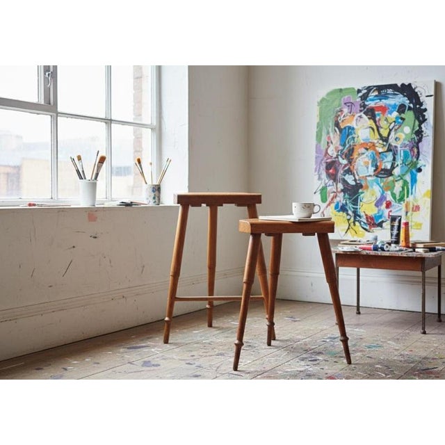 A pair of handcrafted artist stools made of solid pine, dating from the Danish Golden Age, circa 1850s. The stools feature...