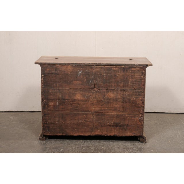 An Italian Butler's wood chest from the 18th century. This unique antique chest from Italy gives the appearance of being a...