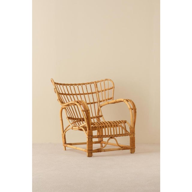 Rattan and cane. Good condition, small signs of usage. This piece is attributed to the mentioned designer/maker. It has no...