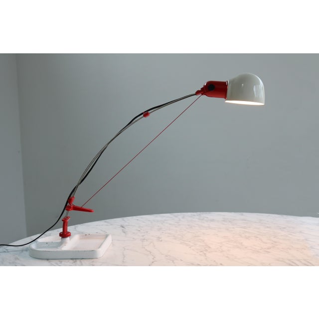 minimalist postmodern table lamp 1980s Simple functional design Heavy cast aluminum base which is shaped as a utensil silo...