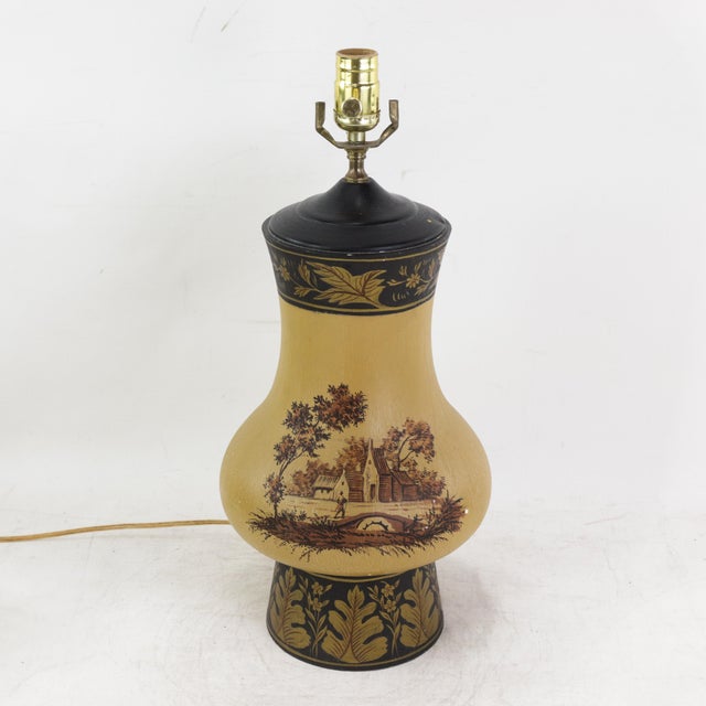 This charming vintage hand-painted table lamp features a graceful baluster silhouette in a warm mustard yellow finish,...