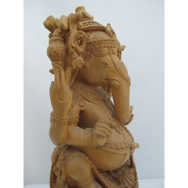 Seated Lord Ganesha Holding Fruit Carved Wood Hindu Deity God Statue on Pedestal For Sale - Image 12 of 13