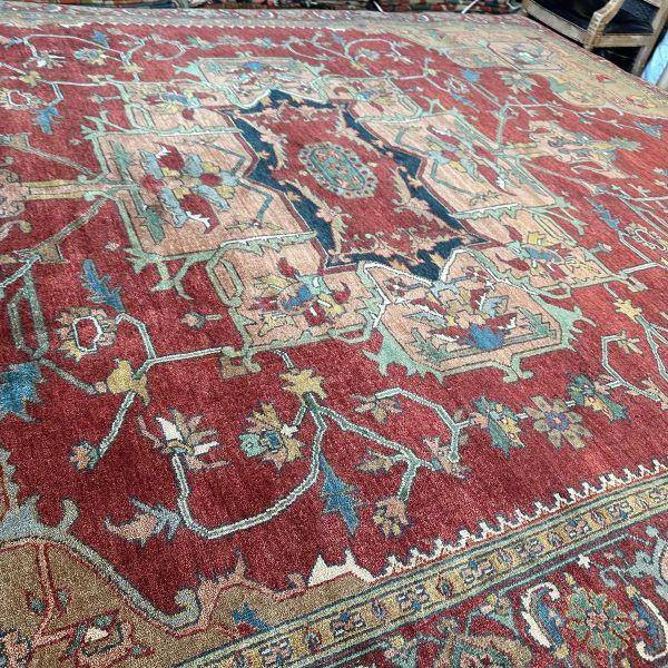 This contemporary Turkish rug draws inspiration from the bold geometry of traditional Heriz designs, reinterpreted through...