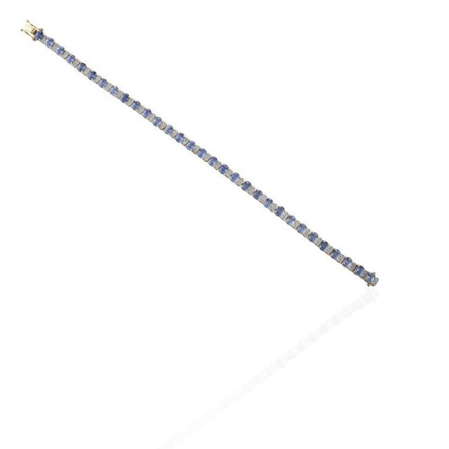 Tennis Bracelet With Blue Sapphire and Diamonds Set in Solid 14k Yellow Gold For Sale In New York - Image 6 of 8