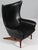 H. W. Klein lounge chair in original black leather Teak base in tilt function. Model 207, made by Bramin This piece is...