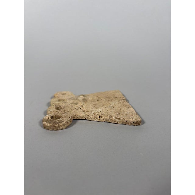 Bell-shaped "eye" idol. Tell Brak, Middle East. It has a bell-shaped body surmounted by two pierced eyes. Sculpture in...