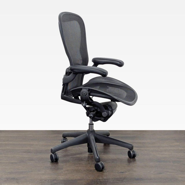 This Herman Miller Aeron chair offers excellent comfort with breathable black mesh and fully adjustable armrests. The...