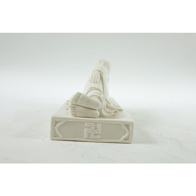 Porcelain Lying Buddha - 12.5” x 4.5” x 5” This serene porcelain sculpture of the Lying Buddha is a graceful...