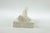 Porcelain Lying Buddha - 12.5” x 4.5” x 5” This serene porcelain sculpture of the Lying Buddha is a graceful...