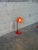 A flexible gooseneck arm gives this table lamp functional directability. The vibrant red cup shade creates a striking...