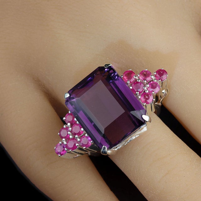 Statement Cocktail Ring: 16.39ct Amethyst with Pink Sapphire Accents Turn heads with this stunning cocktail ring featuring...