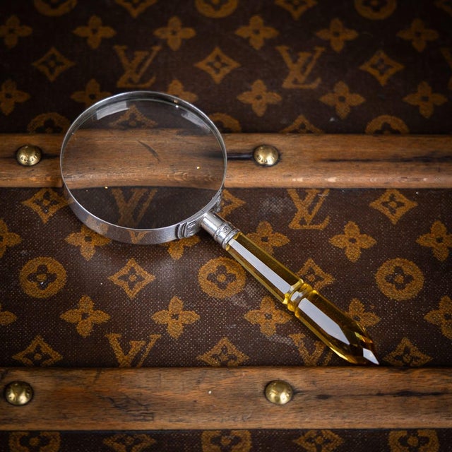 Antique 20th century english solid silver and amber glass magnifying glass. The lens is set within a plain silver rim,...