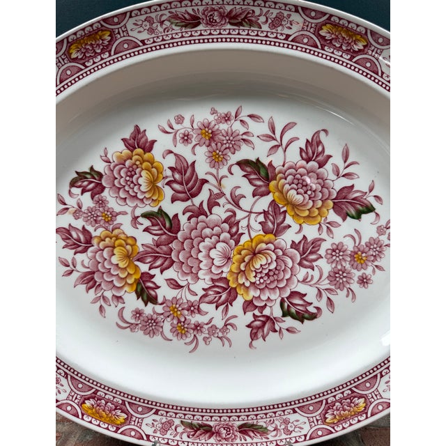 From Staffordshire England, this vintage ironstone transferware platter by Ridgeway is designed using hand engraving. The...