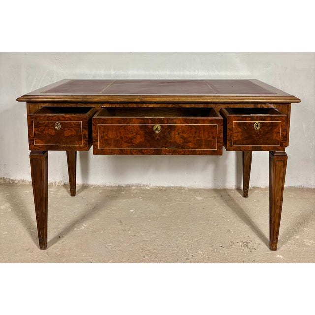 Elegant early 20th century walnut writing desk in the Louis XVI taste, featuring refined neoclassical lines and beautiful...