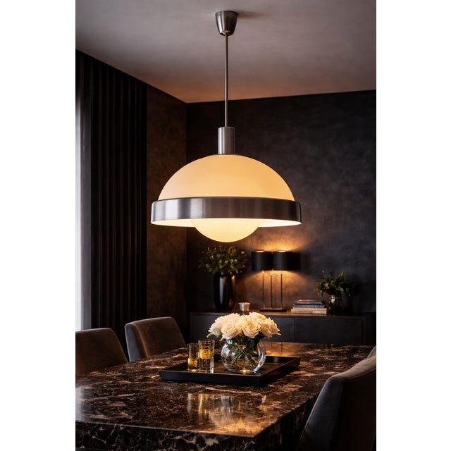 A refined example of 1970s italian design, this chandelier combines formal balance and material quality in a highly...