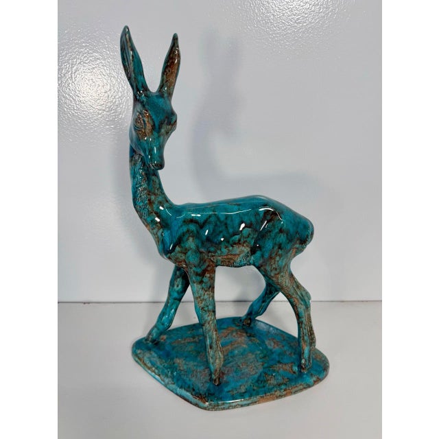Decorative Italian ceramic sculpture depicting a stylized fawn/deer, finished with a beautiful glossy turquoise glaze...