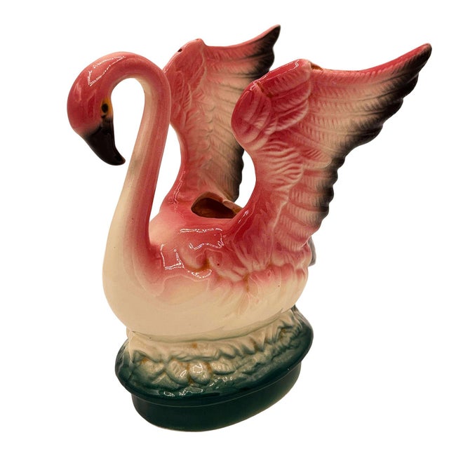 Mid-century pink and green California Pottery ceramic open-wing flamingo tabletop planter. The planter features a...