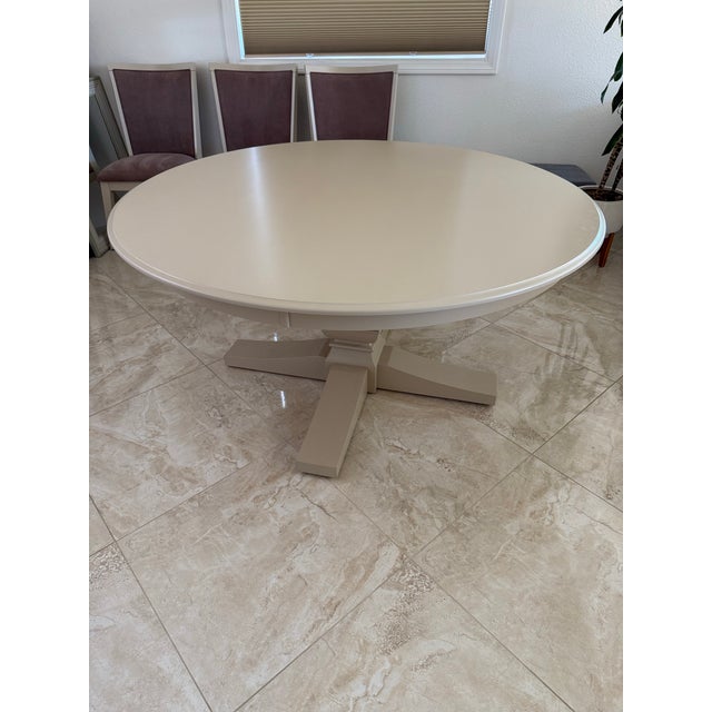 Beautiful Canadel 60 inch round table with 6 chairs in like new condition.