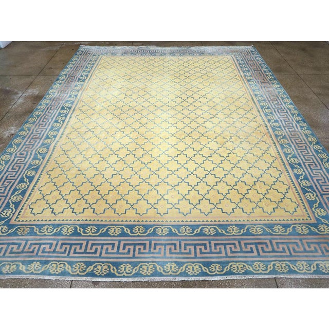 A Indian flatweave Dhurrie large room size carpet handmade during the Mid-20th Century. Measures: 11' 7" x 15' 1"