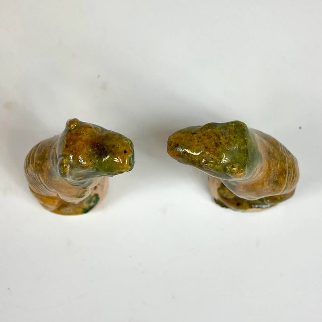 A small set of ceramic grey hound dogs in a pumpkin yellow and green color. They are handmade so they aren’t identical in...