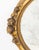 Gilded Age Rose Motif Gilt Composition Oval Beveled Glass Mirror. Mirror plate: 25.5" H x 39.5" W; 33" H x 47" W x 5" D....