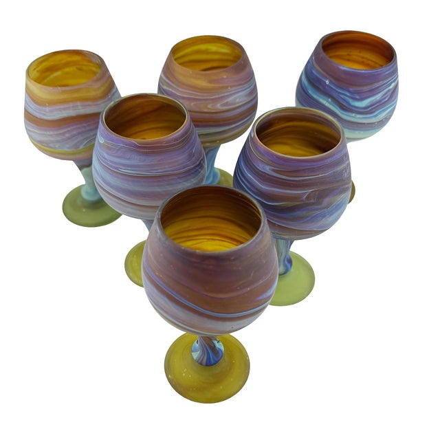 A captivating set of six vintage handblown Hebron glass wine goblets, traditionally known as Phoenician glass, handcrafted...