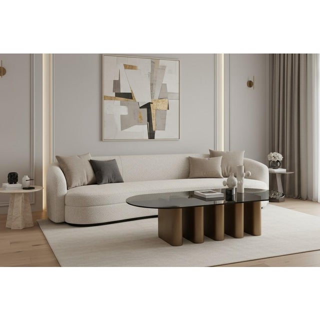 Elevate your living room with this unique sculptural coffee table which is a perfect fusion of modern elegance and...