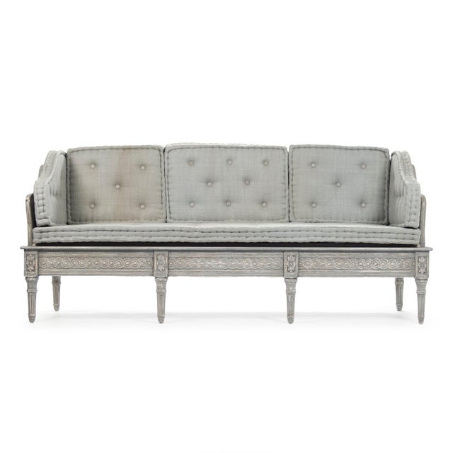 The Tereza Bench from Zentique is a Swedish Gustavian-inspired settee with button-tufted grey-blue raw silk upholstery on...