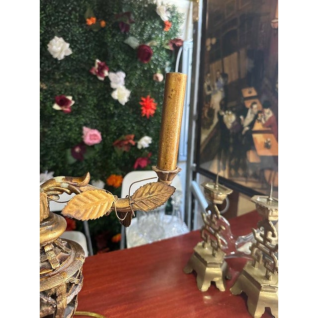 Up for consideration is a beautiful vintage gold double sided table lamp with gold leaf details. This is such a lovely...